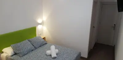Cama o camas de una habitación en Pensión La Estrella