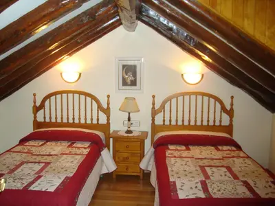 Cama o camas de una habitación en Casa Duplex La Buhardilla
