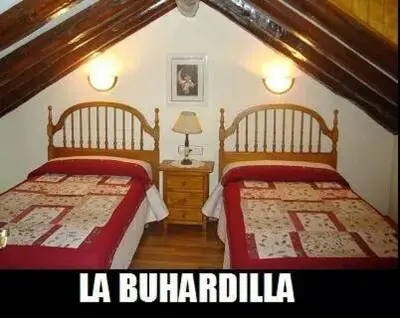 Cama o camas de una habitación en Casa Duplex La Buhardilla
