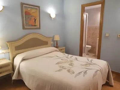 Cama o camas de una habitación en Casa Duplex La Buhardilla