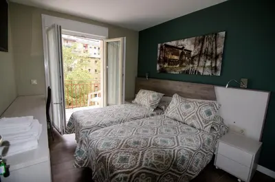 Cama o camas de una habitación en Pensión Ibai Ega