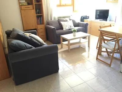 Zona de estar de Atico en Biescas con Piscina, Tenis y Barbacoa
