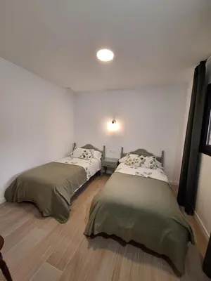 Cama o camas de una habitación en Casas Rurales Los Marqueses