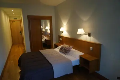 Cama o camas de una habitación en Hotel Elizondo