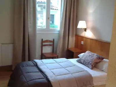 Cama o camas de una habitación en Hotel Elizondo