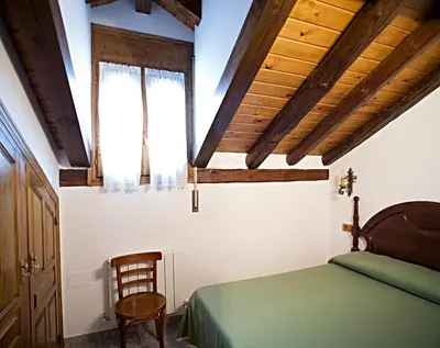 Cama o camas de una habitación en Apartamentos Casa Buisan