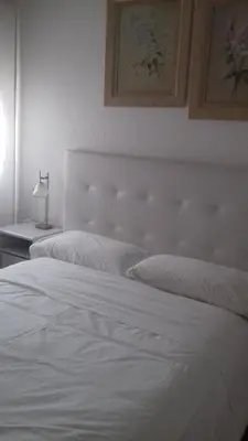 Cama o camas de una habitación en Pensión Room Pamplona