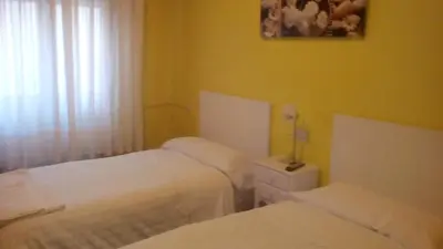 Cama o camas de una habitación en Pensión Room Pamplona