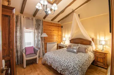 Cama o camas de una habitación en Magnifica casa rural para familias en Navarra