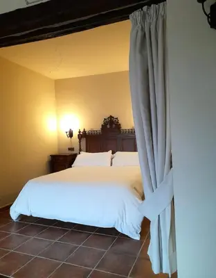 Cama o camas de una habitación en Hotel SPA Don Iñigo de Aragón