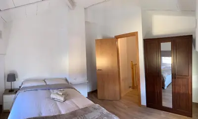 Cama o camas de una habitación en APARTAMENTS IMPRO