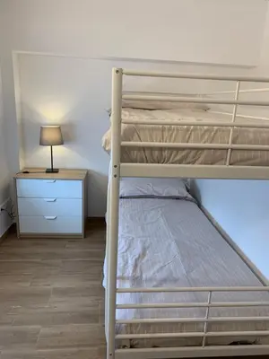 Cama o camas de una habitación en APARTAMENTS IMPRO