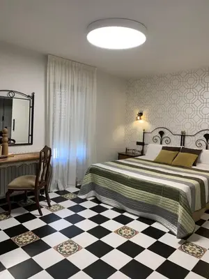 Cama o camas de una habitación en Hostal El Lechuguero