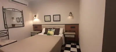 Cama o camas de una habitación en Hostal El Lechuguero