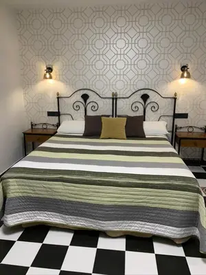 Cama o camas de una habitación en Hostal El Lechuguero