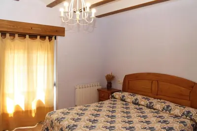 Cama o camas de una habitación en Apartamentos Clavería