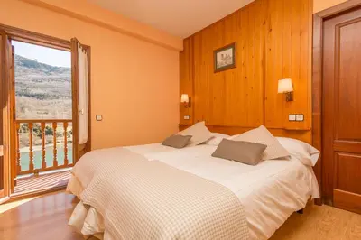 Cama o camas de una habitación en Hostal Casa Rosita