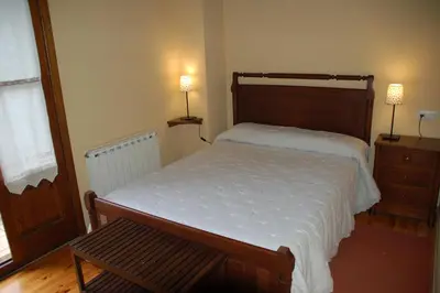 Cama o camas de una habitación en Hostal Casa Rosita