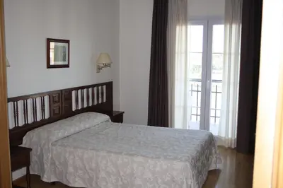 Cama o camas de una habitación en Hotel Mar de Aragón