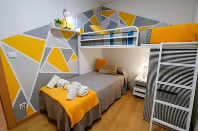 Cama o camas de una habitación en APARTAMENTOS ARGIA 2