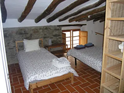 Cama o camas de una habitación en Cal Joanet, acollidora caseta a Gratallops