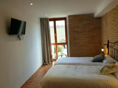 Cama o camas de una habitación en B&B La Atalaya