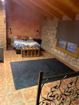 Cama o camas de una habitación en casa rural cal antoniet del matarraña