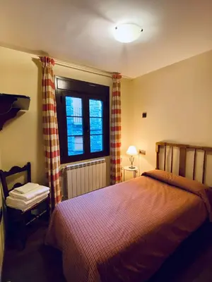Cama o camas de una habitación en Apartamentos Turismo Rural Casa Alfós