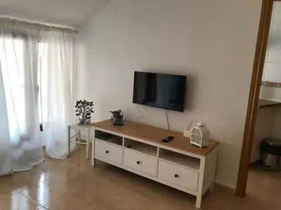 Una televisión o centro de entretenimiento en Apartamento dúplex en el centro de Huesca