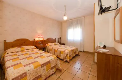 Cama o camas de una habitación en Casa Puyuelo Tierrantona