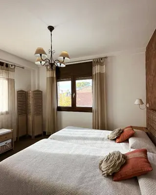 Cama o camas de una habitación en Casa Rural Maria Isabel