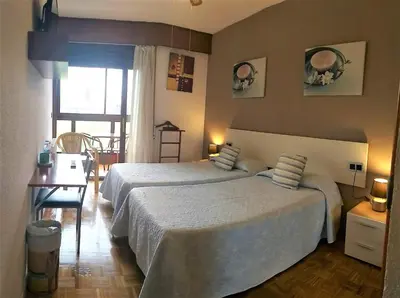 Cama o camas de una habitación en Hostal Meson Del Barro - Alojamientos Pamplona