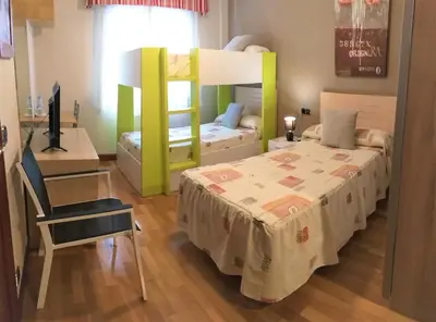 Cama o camas de una habitación en Hostal Meson Del Barro - Alojamientos Pamplona