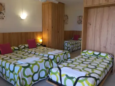 Cama o camas de una habitación en Hostal Meson Del Barro - Alojamientos Pamplona