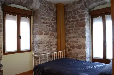 Cama o camas de una habitación en Apartamentos Elizondo