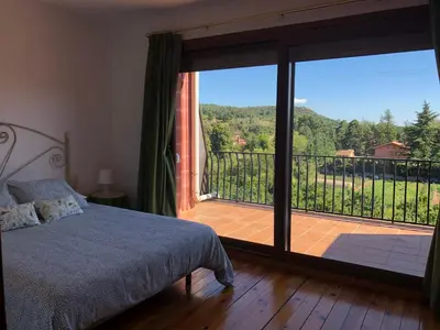 Cama o camas de una habitación en EVA & TRAVEL - Triplex La Cavallada