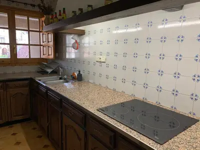 Una cocina o zona de cocina en EVA & TRAVEL - Triplex La Cavallada
