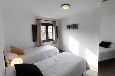 Cama o camas de una habitación en Anayet - Plaza del Reloj en FORMIGAL - by PIRINEOS 360