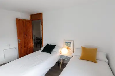 Cama o camas de una habitación en Anayet - Plaza del Reloj en FORMIGAL - by PIRINEOS 360