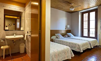 Cama o camas de una habitación en Hostal Victor