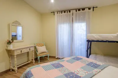 Cama o camas de una habitación en Casa rural MAZA especial grupos