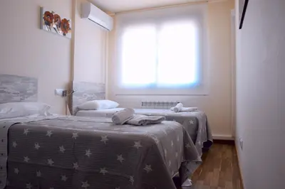Cama o camas de una habitación en Guest House Ainsa Pirineos