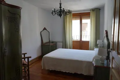 Cama o camas de una habitación en Apartamento «El Balcón de la Calle Mayor»
