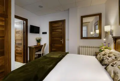 Cama o camas de una habitación en Hostal Bosque de Gamueta