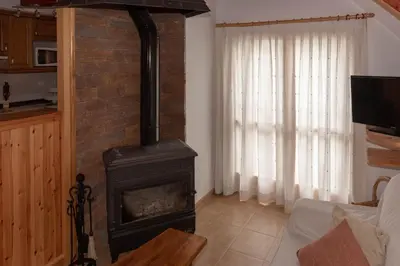 Una televisión o centro de entretenimiento en Apartamento El Molino