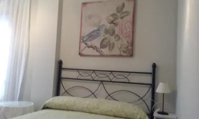 Cama o camas de una habitación en apartamento Valles Blancos 3-6