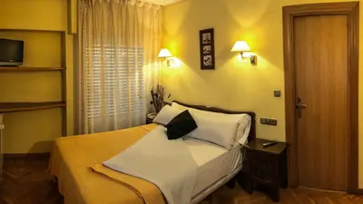 Cama o camas de una habitación en Hotel A Nieu
