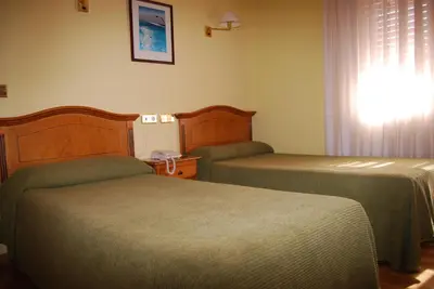 Cama o camas de una habitación en Hotel A Nieu