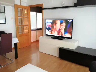 Una televisión o centro de entretenimiento en APARTAMENTO HUESCA