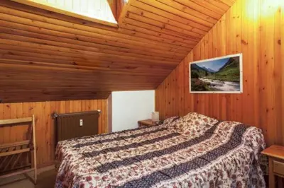 Cama o camas de una habitación en Vielha centro duplex Sapporo